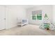 Bedroom with dinosaur tent and white crib at 30 Ocoee Falls Dr, Chapel Hill, NC 27517