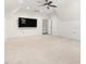 Spacious bonus room featuring a ceiling fan, wall-mounted tv, and neutral paint at 30 Ocoee Falls Dr, Chapel Hill, NC 27517