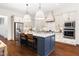 Open-concept kitchen featuring a large island, stainless steel appliances, and recessed lighting at 30 Ocoee Falls Dr, Chapel Hill, NC 27517