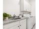 The laundry room features a granite countertop, stainless steel sink, and a new washer and dryer at 30 Ocoee Falls Dr, Chapel Hill, NC 27517