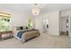 Elegant main bedroom with windows overlooking trees and an ensuite bathroom at 30 Ocoee Falls Dr, Chapel Hill, NC 27517