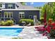 Outdoor pool area featuring lounge chairs and steps leading into the pool with a barbecue grill at 30 Ocoee Falls Dr, Chapel Hill, NC 27517