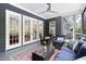 Screened-in porch featuring comfortable seating and views of the beautiful outdoor scenery at 30 Ocoee Falls Dr, Chapel Hill, NC 27517