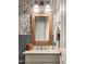 Powder room featuring a decorative wood-framed mirror and granite countertop at 30 Ocoee Falls Dr, Chapel Hill, NC 27517