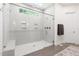 Modern shower with glass enclosure, white subway tiles, and a built-in bench at 30 Ocoee Falls Dr, Chapel Hill, NC 27517