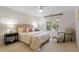 Bright bedroom featuring a queen bed, neutral colors, and natural light from the window at 300 Livingstone Dr, Cary, NC 27513