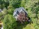 Beautiful home with well-manicured lawn, mature trees, and lush landscaping at 300 Livingstone Dr, Cary, NC 27513