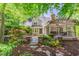 Charming home with a well-manicured front yard and stone walkway leading to a covered porch at 300 Livingstone Dr, Cary, NC 27513