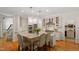 Bright, spacious kitchen with granite counters, stainless steel appliances, and hardwood floors at 300 Livingstone Dr, Cary, NC 27513
