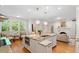 Open-concept kitchen with a large island, stainless steel appliances, and hardwood floors at 300 Livingstone Dr, Cary, NC 27513