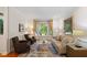 Cozy living room with comfortable seating, a large window, and stylish decor at 300 Livingstone Dr, Cary, NC 27513