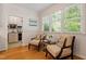 Cozy sitting area with natural light, comfortable seating, and serene views at 300 Livingstone Dr, Cary, NC 27513