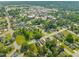 Lush neighborhood aerial showcasing a mix of housing and greenery, with easy access to amenities at 305 E Holmes St, Benson, NC 27504