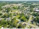 An expansive aerial view of a residential neighborhood with mature trees and green spaces at 305 E Holmes St, Benson, NC 27504