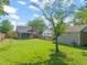 Large backyard with a screened-in porch and detached garage at 305 E Holmes St, Benson, NC 27504