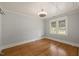Bedroom with neutral colored walls, hardwood floors, and a ceiling fan at 305 E Holmes St, Benson, NC 27504