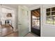 Charming entryway with access to the kitchen and screened-in porch at 305 E Holmes St, Benson, NC 27504