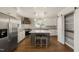 Modern kitchen with stainless steel appliances, a center island, and a walk-in pantry at 305 E Holmes St, Benson, NC 27504
