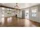Spacious living room features a decorative fireplace, hardwood floors, and lots of natural light at 305 E Holmes St, Benson, NC 27504