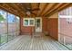 Screened porch with ceiling fan and brick exterior at 305 E Holmes St, Benson, NC 27504