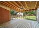 Screened porch with ceiling fan, string lights, and wood flooring at 305 E Holmes St, Benson, NC 27504