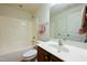 Bathroom featuring a vanity sink, a toilet, and a shower/tub combo with tile surround at 306 Mainline Station Dr, Morrisville, NC 27560