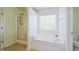Bright bathroom features a soaking tub, glass shower, and natural light at 306 Mainline Station Dr, Morrisville, NC 27560
