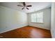 Bedroom featuring wood-look floors, ceiling fan, and natural light from the window at 306 Mainline Station Dr, Morrisville, NC 27560