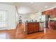 Beautiful kitchen with stainless steel appliances, wooden cabinets and island with granite countertops at 306 Mainline Station Dr, Morrisville, NC 27560