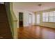Spacious living room with hardwood floors and a staircase, ideal for entertaining and relaxation at 306 Mainline Station Dr, Morrisville, NC 27560