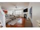 A staged living room featuring hardwood floors, a fireplace, lots of natural light, and neutral colored furniture at 306 Mainline Station Dr, Morrisville, NC 27560