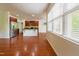 Bright and airy open-concept living space that connects the kitchen with stainless steel appliances at 306 Mainline Station Dr, Morrisville, NC 27560