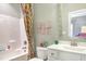 A fun and colorful bathroom features a vibrant shower curtain and a whimsical ' Rule' wall decoration at 318 Ivy Ridge Rd, Chapel Hill, NC 27516