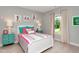 Charming bedroom with colorful bedding, whimsical soccer-themed decor, and natural light from the window at 318 Ivy Ridge Rd, Chapel Hill, NC 27516
