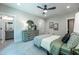 Well decorated bedroom featuring a ceiling fan, dresser, round mirror, and ensuite bathroom at 318 Ivy Ridge Rd, Chapel Hill, NC 27516