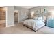 Serene bedroom with soft lighting features a walk in closet, neutral color scheme, and teal accents at 318 Ivy Ridge Rd, Chapel Hill, NC 27516