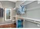 A well-organized closet featuring bright lighting, clothing racks, shelving, and hardwood floors at 318 Ivy Ridge Rd, Chapel Hill, NC 27516