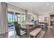Open dining area with views of the screened porch, kitchen, and fireplace with lots of natural light at 318 Ivy Ridge Rd, Chapel Hill, NC 27516