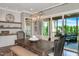 Dining room with a wooden table, stylish chairs, and access to a screened-in porch at 318 Ivy Ridge Rd, Chapel Hill, NC 27516