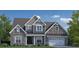 Beautiful new construction home featuring stone and siding accents, a covered porch, and an attached two-car garage at 318 Ivy Ridge Rd, Chapel Hill, NC 27516