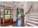 Welcoming foyer with hardwood floors, elegant trim work, and a view into the adjacent living space at 318 Ivy Ridge Rd, Chapel Hill, NC 27516