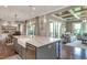 Open-concept kitchen with a large island, stainless steel appliances, and views into the dining and living areas at 318 Ivy Ridge Rd, Chapel Hill, NC 27516