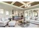 Inviting living room featuring a fireplace, comfortable seating, and open access to the kitchen at 318 Ivy Ridge Rd, Chapel Hill, NC 27516