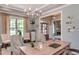 Well-lit home office with a large desk, comfortable seating, and views of the surrounding landscape at 318 Ivy Ridge Rd, Chapel Hill, NC 27516