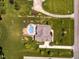 Aerial view showing property with in-ground pool and lush landscaping at 3403 Raccoon Run Dr, Burlington, NC 27215