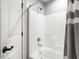 Clean, white bathroom with a shower and tub combo at 3403 Raccoon Run Dr, Burlington, NC 27215