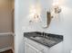 Bathroom with a vanity, mirror, and sconces; decorative sink basin at 3403 Raccoon Run Dr, Burlington, NC 27215