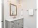 Stylish bathroom featuring a white vanity with gold hardware and matching mirror at 3403 Raccoon Run Dr, Burlington, NC 27215