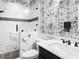 Unique bathroom with a shower and black and white patterned wallpaper at 3403 Raccoon Run Dr, Burlington, NC 27215