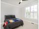 Comfortable bedroom featuring a bed, ceiling fan, and shutters at 3403 Raccoon Run Dr, Burlington, NC 27215